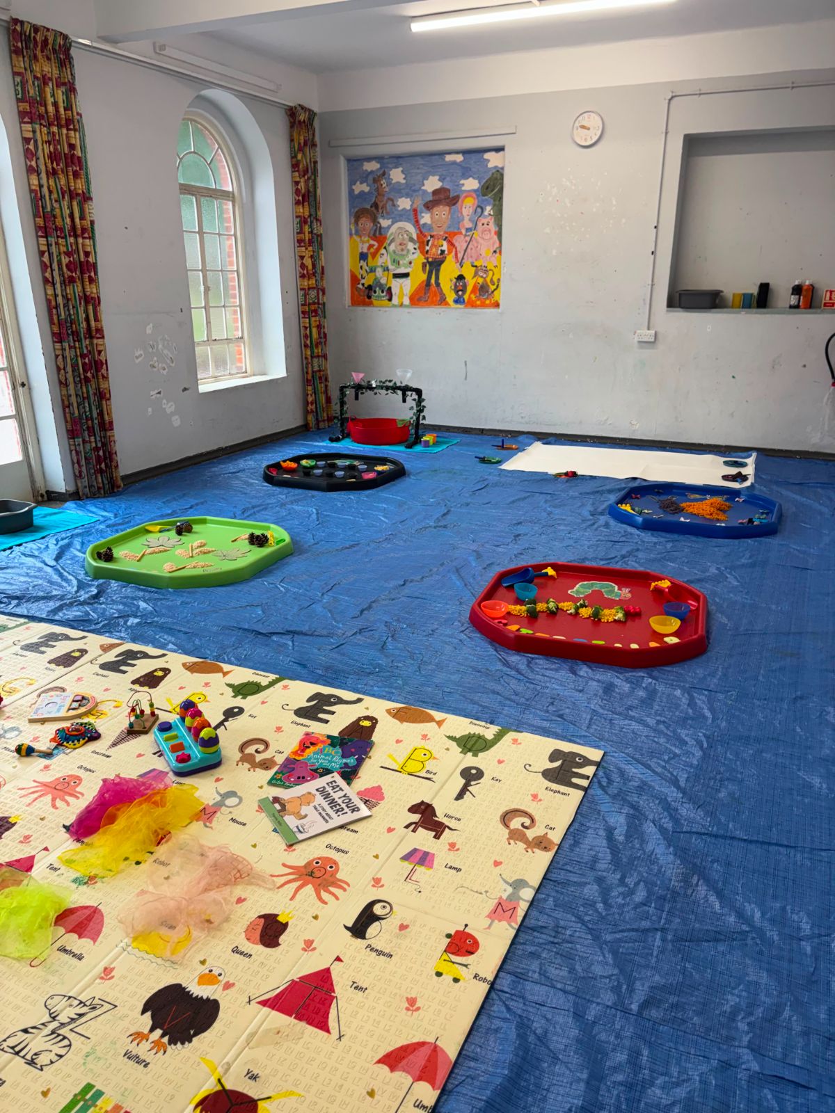 Messy play trays set up for children